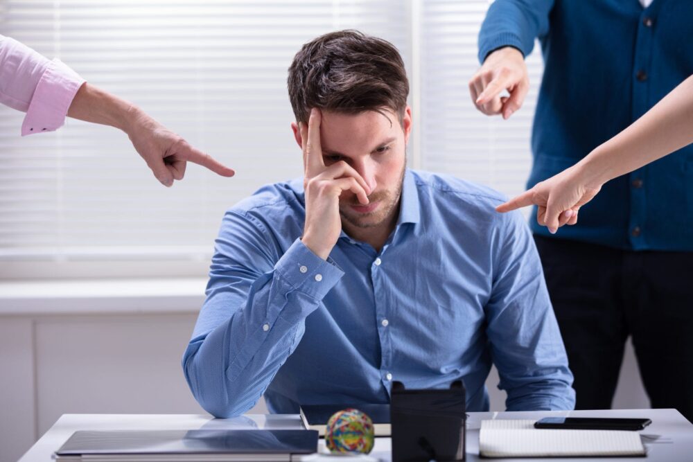 Retaliation: Facing Negative Treatment For Reporting a Coworker? | Header Image | McOmber McOmber & Luber