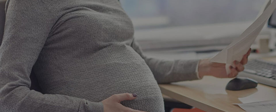 How Can I Support Colleagues Facing Pregnancy Discrimination in the Workplace? | Header Image | McOmber McOmber & Luber